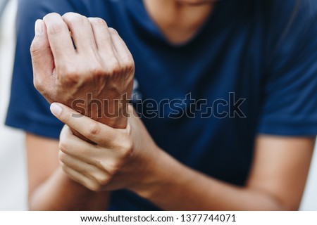 Close up young woman wrist pain, health care concept