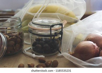 Close up of zero waste containers, like jars and net sacks, and biological food