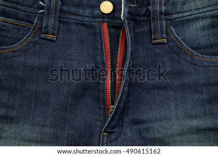 close up zipper of blue jean background