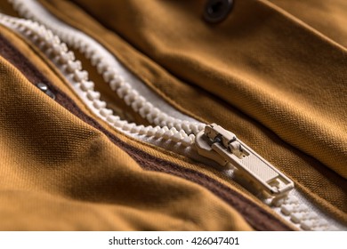 Close Up Of Zipper On Brown Coat