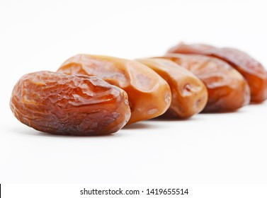 Close Up And Zoom On The First Date Fruits And Blur Behind On White Background