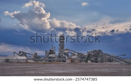 The closed and abandoned Zin phosphate mining plant located in a nature reserve in the Negev Desert, Israel. Heavy rainy clouds in the sky.                               