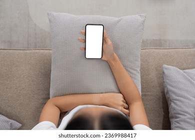 Closed up with Asian woman feels relax using smartphone in living room, Blank screen of smartphone - Shutterstock ID 2369988417