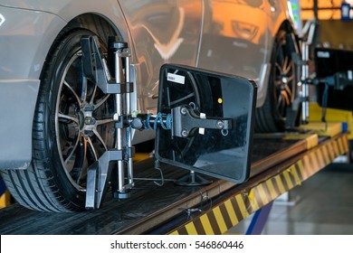 Closed Up Of An Auto Wheel : Wheel Alignment.
Balancing Tire Wheel Machine. Tyre Assembling. Tire Balance - Car Service