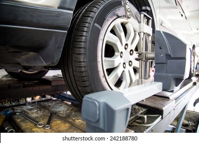 Closed Up Of An Auto Wheel That Is Undergoing Wheel Alignment