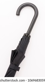 A Closed Black Umbrella And White Background