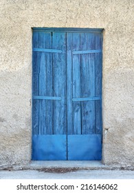 Closed blue door in Greece