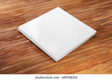 Closed Book With Blank Cover On Wooden Background