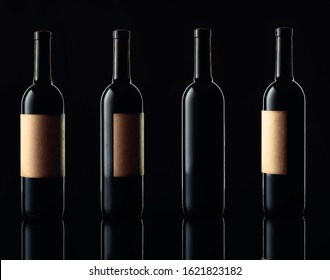 Closed Bottle Of Red Wine With Empty Old Paper Label On A Black Reflective Background. Free Space For Your Content.