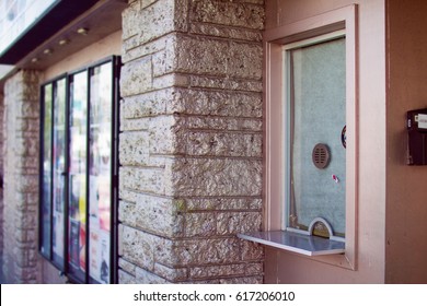 Closed Box Office TIcket Window At A Brick Theater Venue