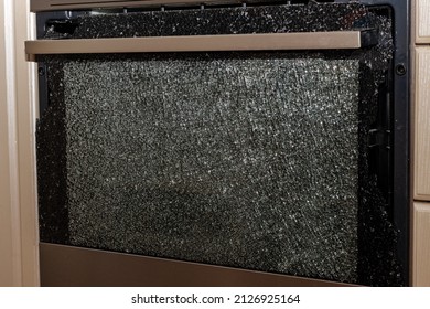 Closed Broken Oven Door, Close-up, Front View. Broken Glass. Warranty Repair