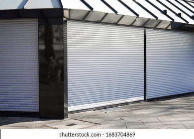 Closed Business Shop Or Store Front With Roller Shutters - Economy Crisis And Recession Concept