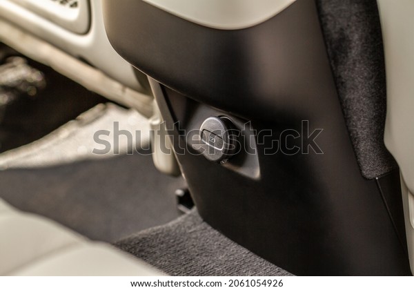 Closed car USB port
in the car for connecting device. Power output of usb charger close
up view. Car interior.