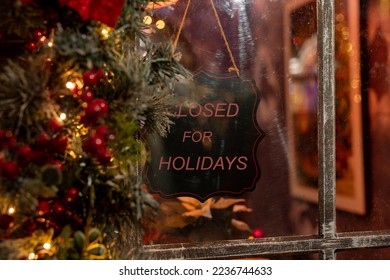 Closed for Christmas holidays in winter time. Shop, store, cafe business closing for vacations. Sign board on window. High quality photo - Powered by Shutterstock