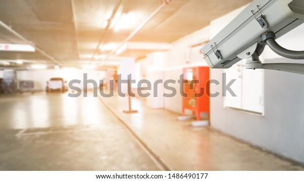 Closed Circuit TV Camera and security maintenance in\
parking lot.