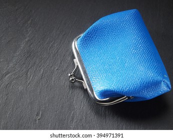 Closed Coin Purse On The Black Slate