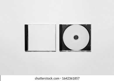 Closed compact plastic Disc Box Case with white isolated blank for branding design. CD jewel mock-up on soft gray background 