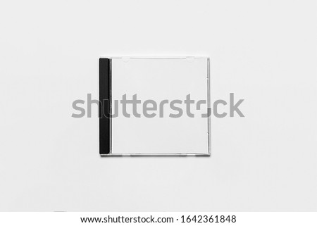 Closed compact plastic disc box case with white isolated blank for branding design. CD jewel mock-up on soft gray background 