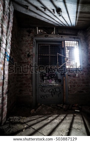Closed door at dirty abandoned factory