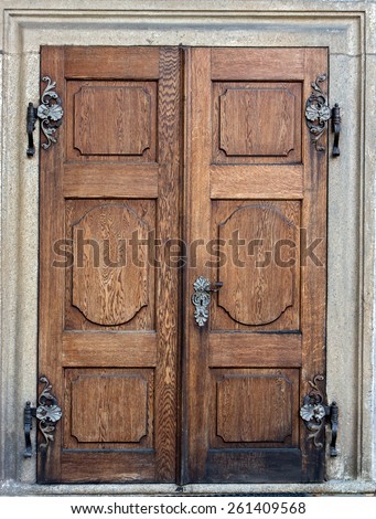 Closed doors at the Castle Czech Krumlov. Old wooden decorative door. Historical door with decorative ironwork to the castle Cesky Krumlov, Czech republic.