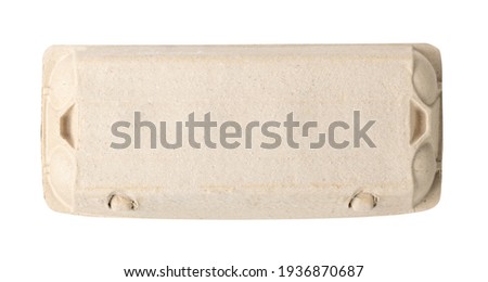 Closed egg box with ten eggs isolated on white background with clipping path. Close carton pack or egg container top view with copy space