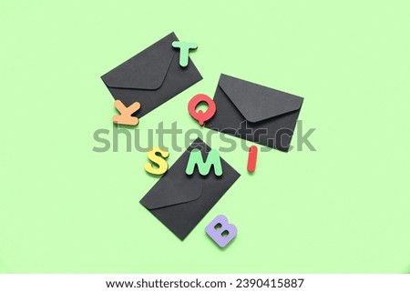 Closed envelopes and letters on green background