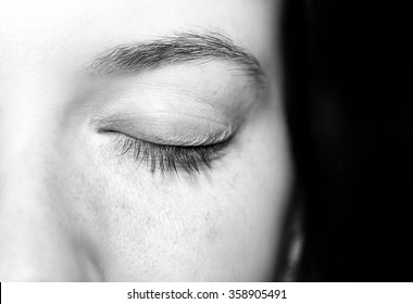 Closed eye of young caucasian woman