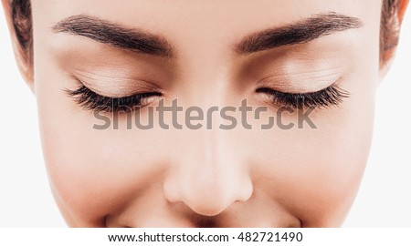 Closed eyes lashes closeup. Beauty Spa Woman with perfect healthy face skin Portrait. Beautiful model Spa Girl isolated on white 