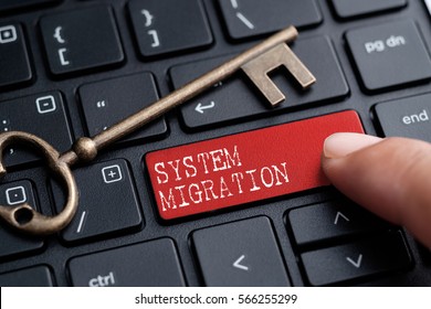 Closed Up Finger On Keyboard With Word SYSTEM MIGRATION