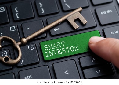 Closed Up Finger On Keyboard With Word SMART INVESTOR