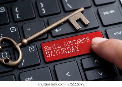 Closed Up Finger On Keyboard With Word SMALL BUSINESS SATURDAY