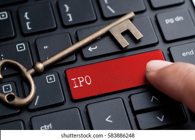 Closed up finger on keyboard with word IPO