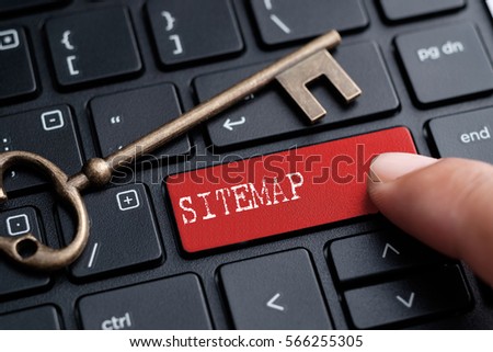 Closed up finger on keyboard with word SITEMAP