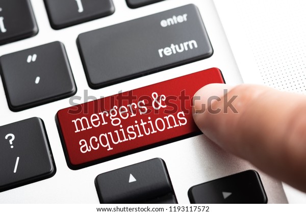Closed up finger on keyboard with word\
MERGERS &\
ACQUISITIONS
