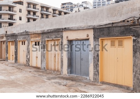Closed gates of boat garage on the coast of Mellieha bay, Malta