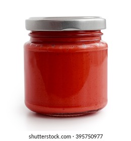 Closed Glass Jar Of Red Tomato Sauce. Isolated In Low Perspective On White.