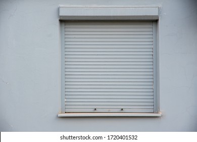 closed gray blinds on the window. The concept of a problem in the trade or nobody is in the house