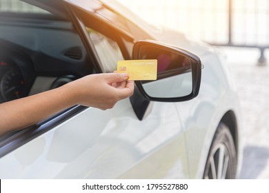 Closed Up Hand Use Credit Card On Car To Pay For Fuel