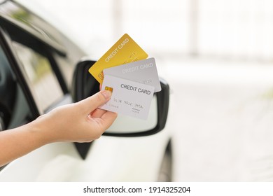 Closed Up Hand Use Credit Card On Car To Pay Or To Access The Gate