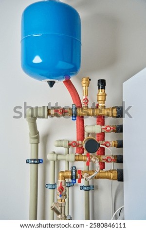 Closed heating system featuring expansion tank, pipes, and shut-off valves, ensuring efficient thermal expansion control