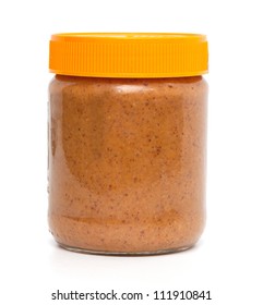 closed jar of peanut butter over white