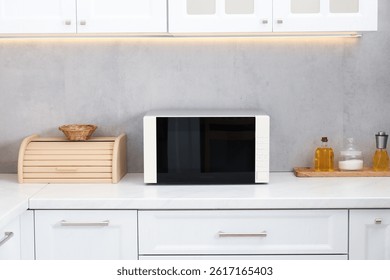 Closed microwave oven on counter in kitchen