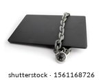 a closed notebook computer with a chain and combination lock wrapped around it isolated on white