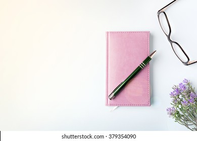 Closed Notebook With Pen On Blue Table, Flat Lay