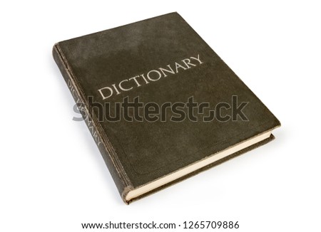 Closed old hardback dictionary with cloth cover on a white background