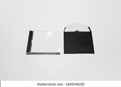 Closed And Open Compact Plastic And Paper Disc Box Case With White Isolated Blank For Branding Design. CD Jewel Mock-up On Soft Gray Background.High Resolution Photo.