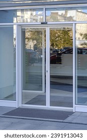 Closed Pair of Automatic Doors With Sensor Detection Commercial Building Entrance