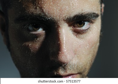 Closed portrait of a man with water drops