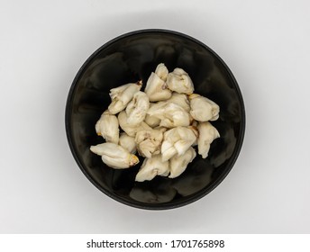 Closed Up Premium Jumbo Lump Of Fresh Blue Crab Meat In Small Black Ceramic Bowl Isolated On White Background.