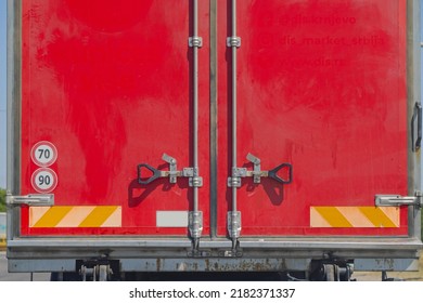 Closed Rear Doors At Red Lorry Truck Trailer